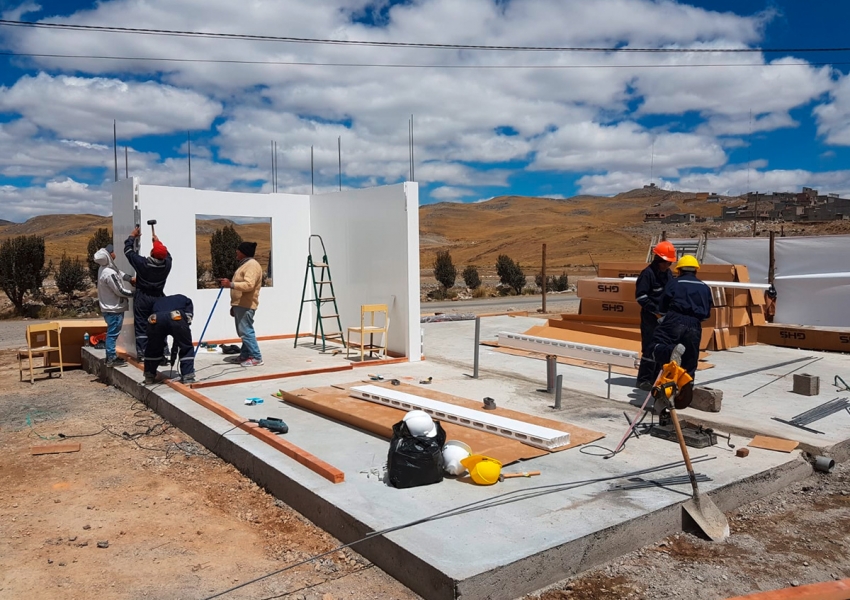 Day 3-6: After the slab is constructed, walls are built by pouring concrete.