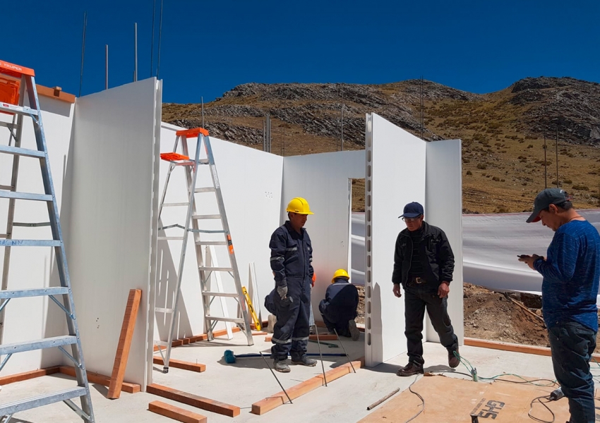 Day 3-6: After the slab is constructed, walls are built by pouring concrete.